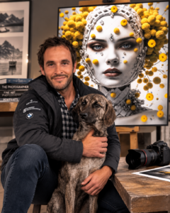 Laurent Leoncini with his dog beside one of his contemporary fine art photography prints.