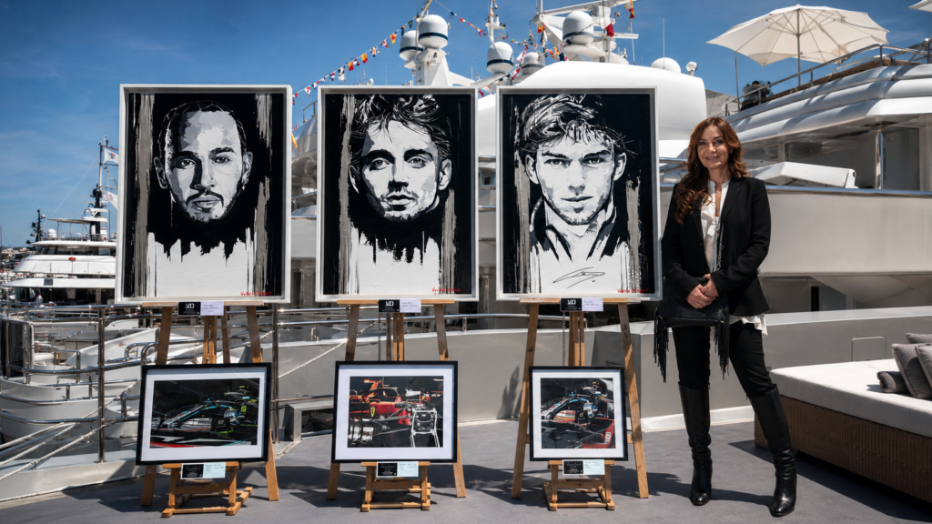 Valérie Durand presenting her Formula One artworks aboard a luxury yacht in Monaco.