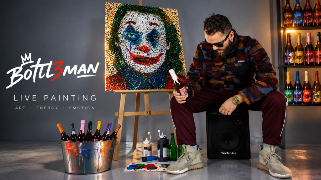Bottl3man posing with a custom live painting featuring the Carton Rouge logo during an exclusive art exhibition.
