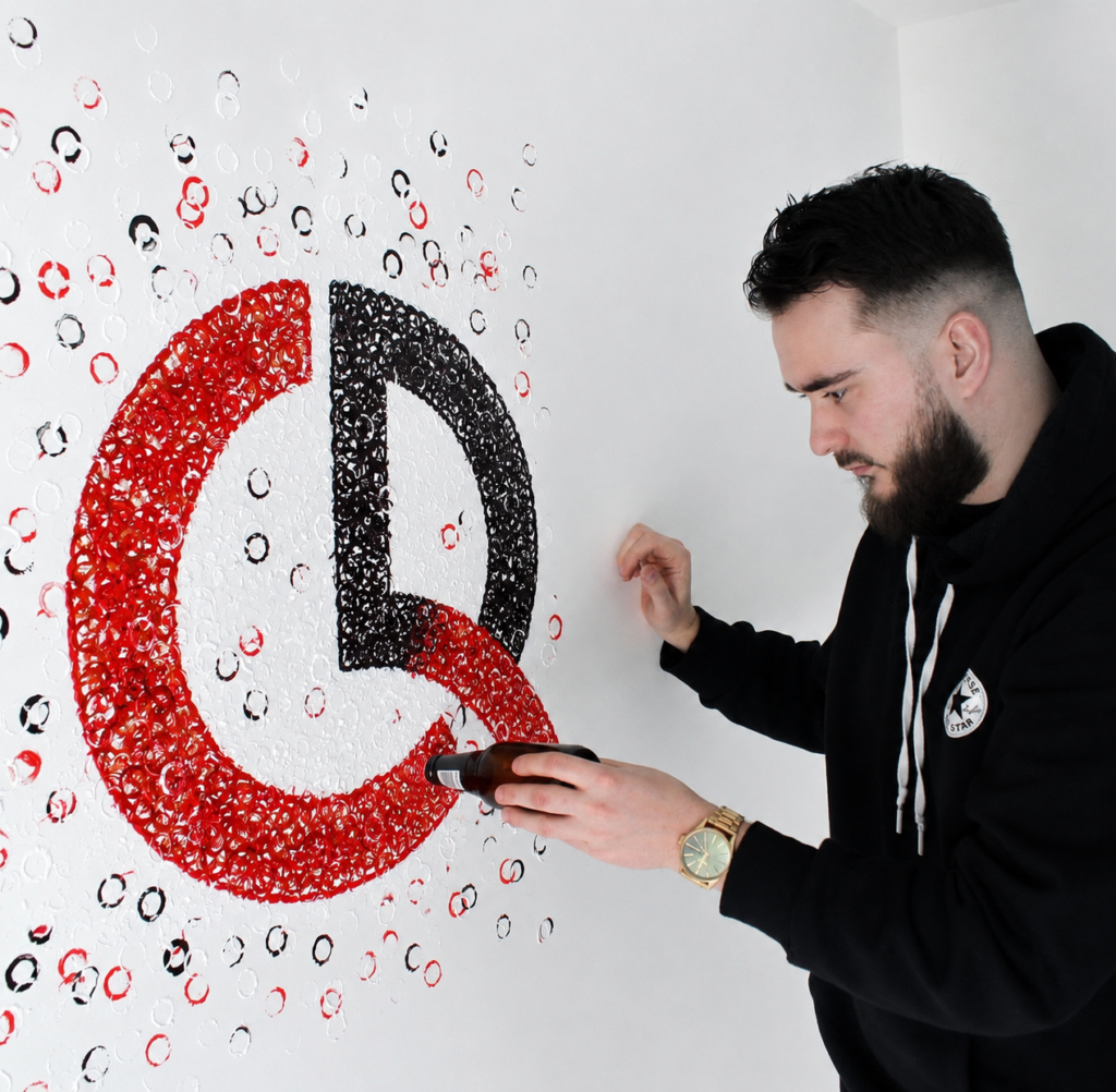 Bottl3man creating a live painting performance featuring the Carton Rouge logo during a contemporary art event.