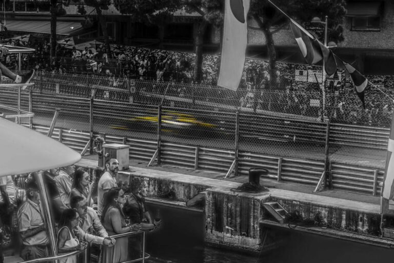 Fine art photograph of a yellow Formula One racing car in motion by French photographer Laurent Leoncini.