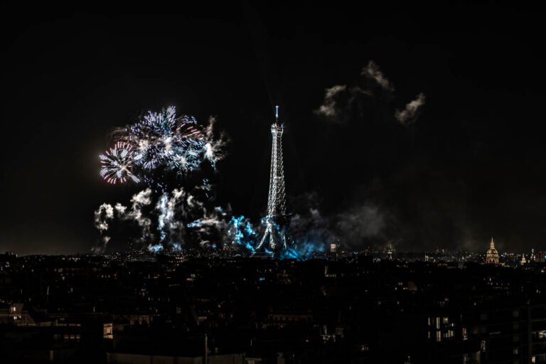 Digital artwork of the Eiffel Tower at night illuminated over Paris, created by French artist Laurent Leoncini.